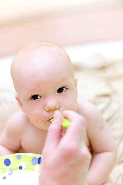 istock Mother feed baby by porridge #1 89221075