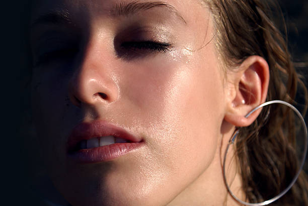 close up of a young girl's face stock photo