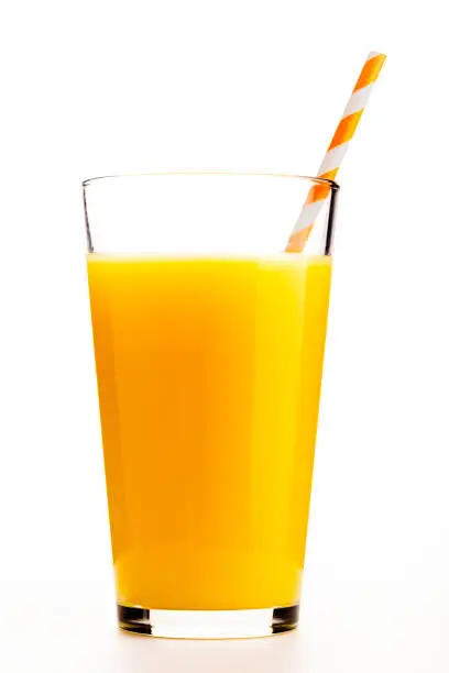 One glass of orange juice with an orange straw