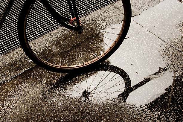 istock Bike wheel in puddle 89224793