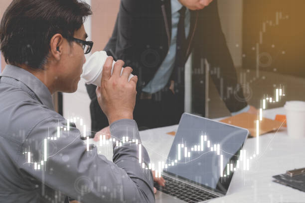 istock business workplace concept : businessman using computer , smart people trade invest by internet 892249652