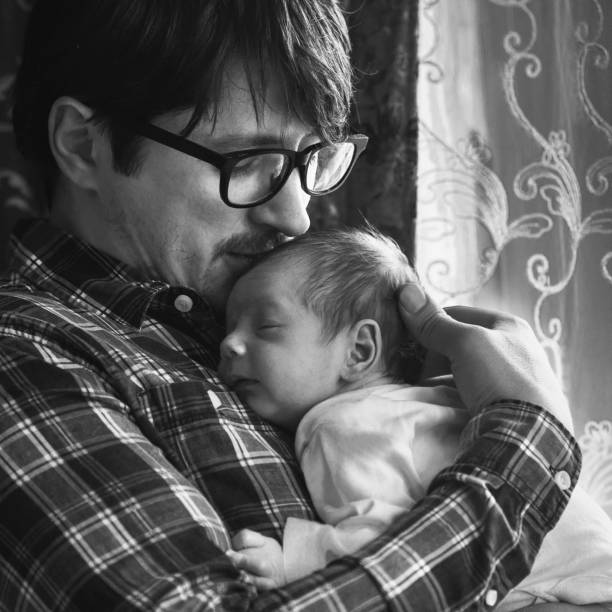 istock Father with newborn baby in B&W 892252482