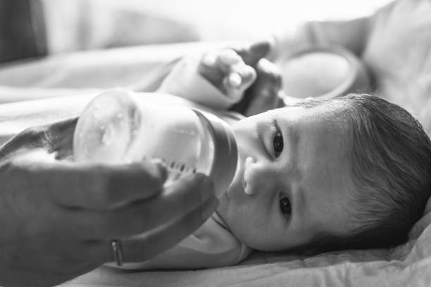 istock Newborn baby drinking milk 892252516