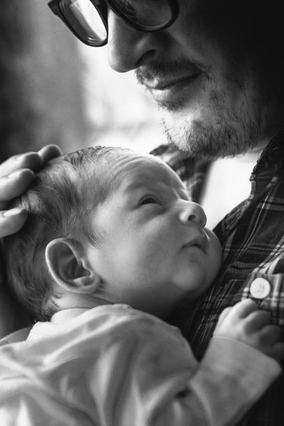istock Father with newborn baby in B&W 892252554