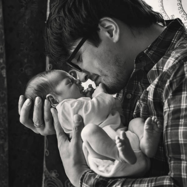 istock Father with newborn baby in B&W 892252564