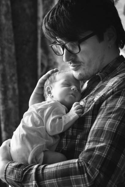 istock Father with newborn baby in B&W 892252580