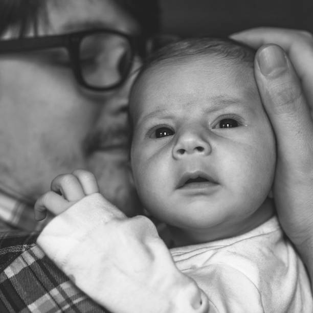 istock Father with newborn baby in B&W 892254738