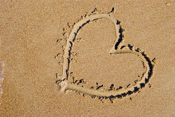 istock heart on sand at sea beach 89225718
