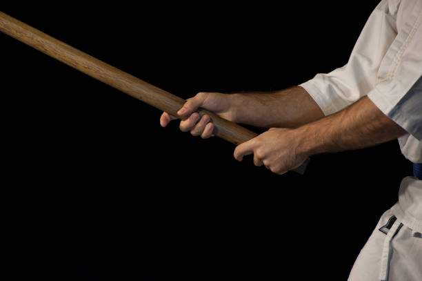 istock Blue belt aikido fighter in attack position 892267080
