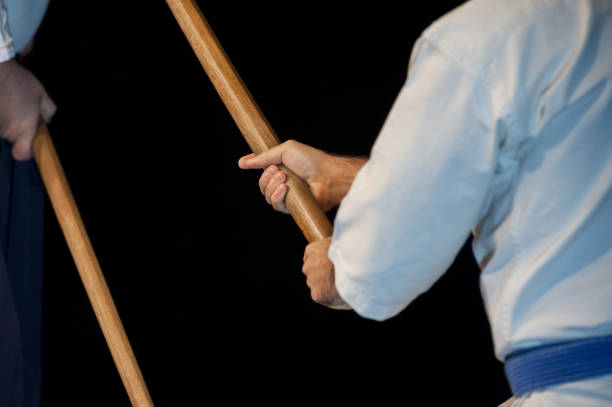 istock Blue belt aikido fighter in attack position 892272140