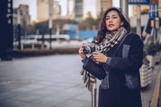 istock Traveling woman taking photos 892275300