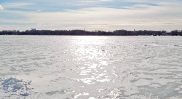 istock winter river covered with ice in the city 892281636