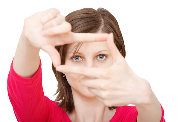 istock young brunette woman with framing hands 89228379