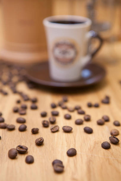 istock A cup of coffee and spilled coffee beans. 892285686