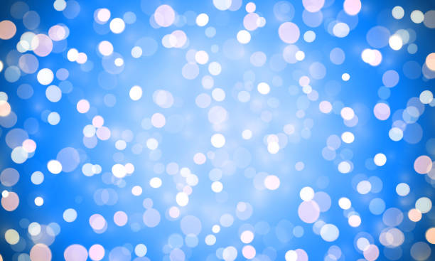 istock Light shine of sparkling confetti glitter effect on blue background. Vector shiny bokeh lights for Christmas or birthday background design template. Magic glittering glow with lens flare white light 892288870