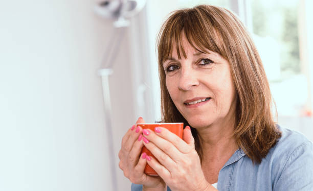 istock Mature woman during coffee break at home 892300058