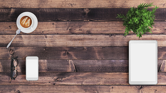 Business office desk top view knolling concept, plant, coffee cup, blank part of the table for copy space,smartphone, tablet, template designer mock up render, wooden table