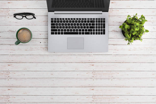 istock Knolling business desk view with laptop 892303084