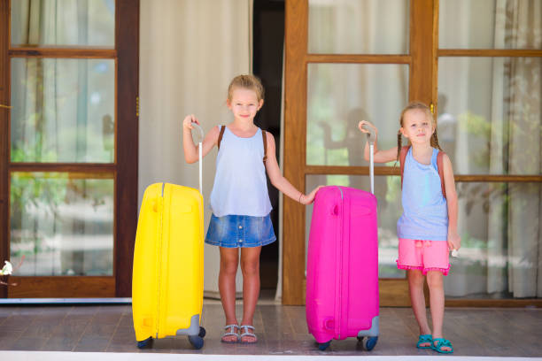 istock Kids with 2 luggages ready to travel 892312764