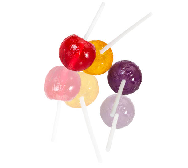istock colorful lolly pop candies on white with reflection 892313634