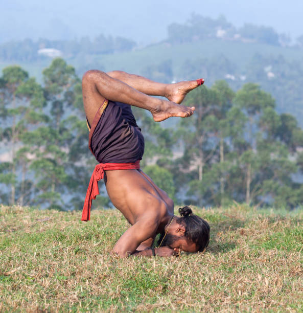 istock Indian man doing yoga exercises 892333090