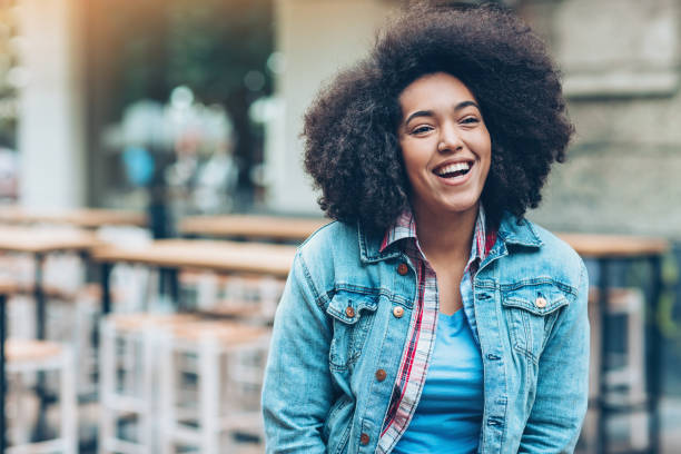 istock Beautiful laughing girl in a sidewalk cafe 892333690