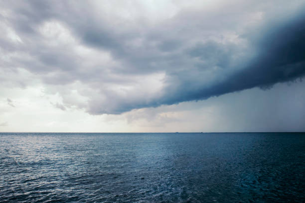 istock Storm clouds over the blue sea. 892339170
