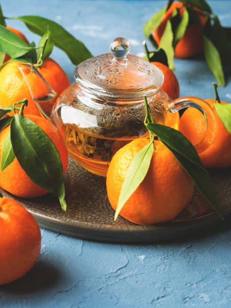 istock Tangerines and green tea still life 892341218