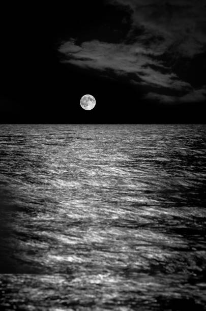 istock Full moon over the sea, long exposure. 892345754