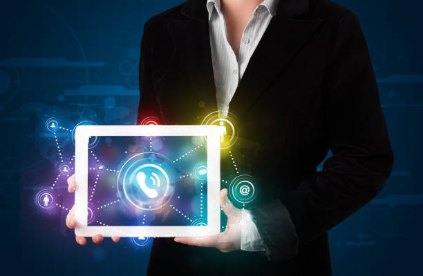 istock Woman showing social networking technology with colorful lights 892354006