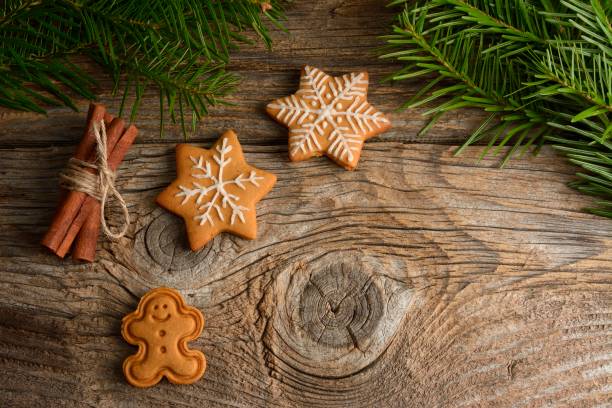 istock gingerbread cookies on wooden background 892355886