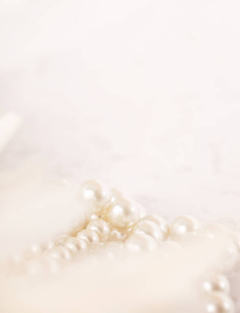 istock Pile of pearls on the white background 892357458