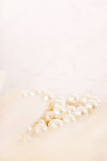istock Pile of pearls on the white background 892357460