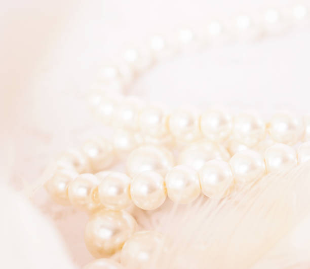 istock Pile of pearls on the white background 892357496
