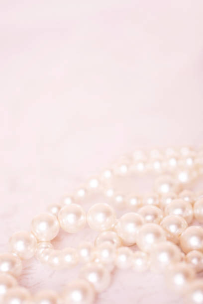 istock Pile of pearls on the white background 892357512