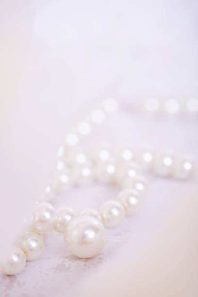 istock Pile of pearls on the white background 892357514
