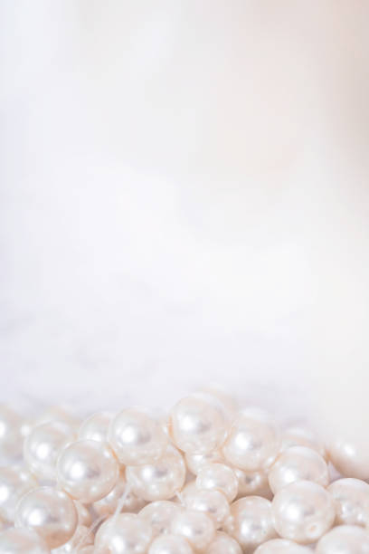 istock Pile of pearls on the white background 892357532