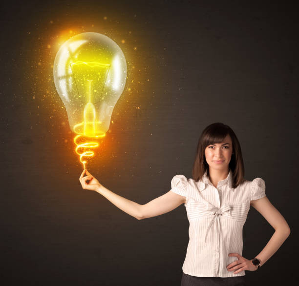 istock Businesswoman with an idea bulb 892357682