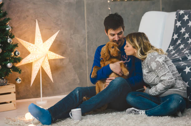 istock Young couple having fun at Christmas time 892357740