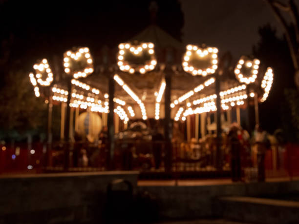 The old carousel is photographed while spinning on a long aperture to give the sense of movement.