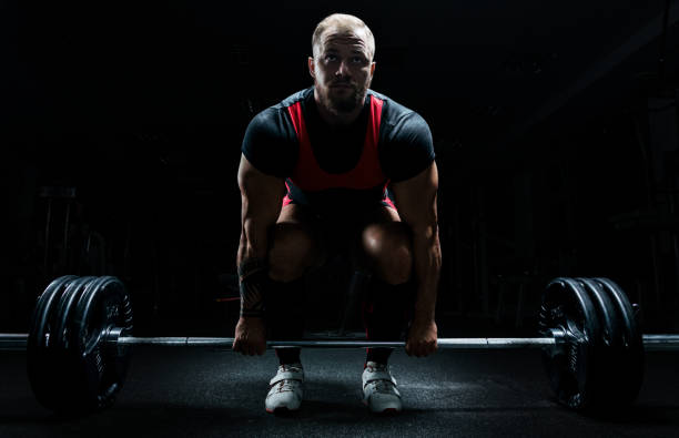 istock Huge man is preparing to perform an exercise called deadlift. 892366964