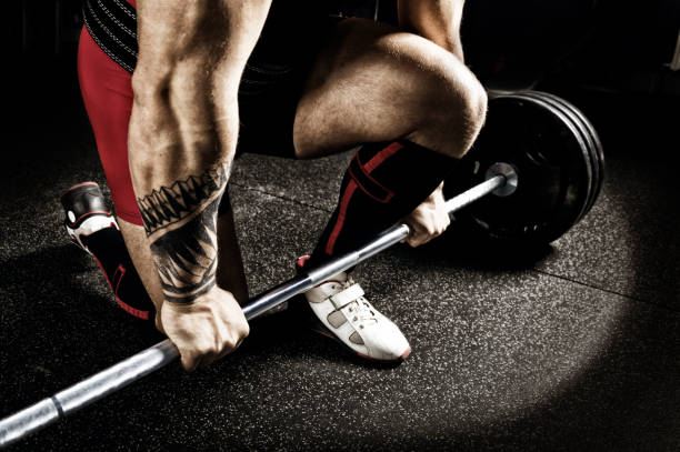 istock Professional powerlifter prepares for deadlift. View from above. 892366972