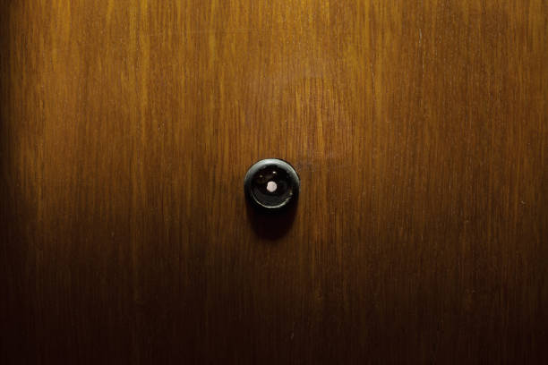 istock Peephole In Wooden Doors 892370898