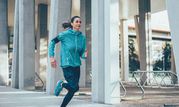 istock Woman jogging outdoors 892376066
