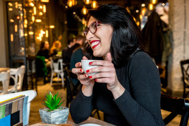istock The girl drinks coffee in the coffee 892378540