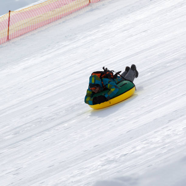istock Snow tubing on ski resort 892379554