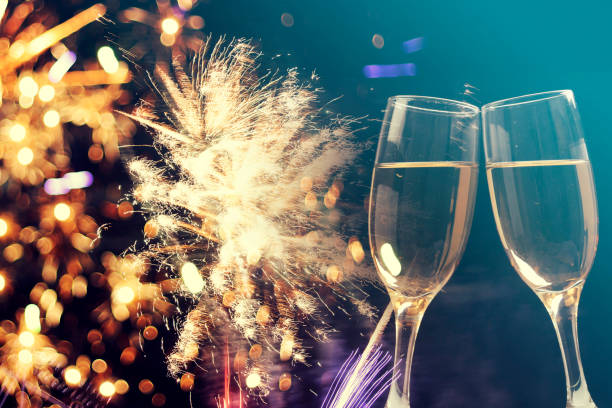 istock Champagne glasses on sparkling background 892382028