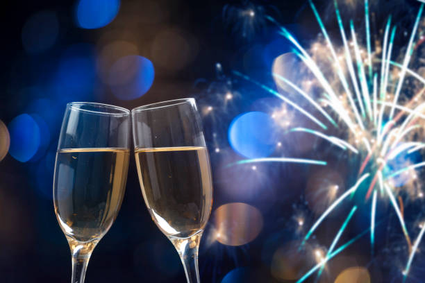 istock Champagne glasses on sparkling background 892382350