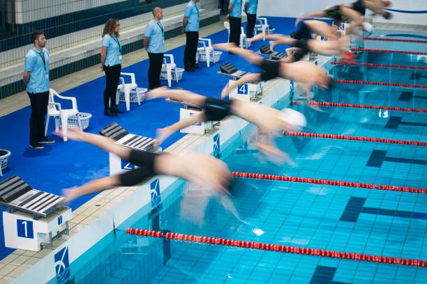 istock Start of a freestyle swimming race 892387788