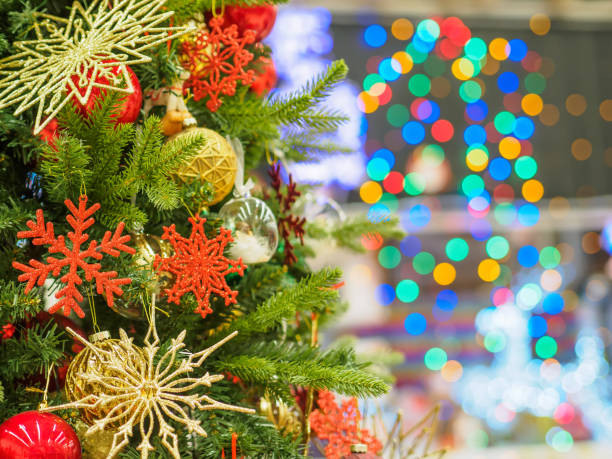 istock Bright and beautifully decorated with toys Christmas tree against shiny illuminated soft focused background. Christmas and New Year concept. 892394852